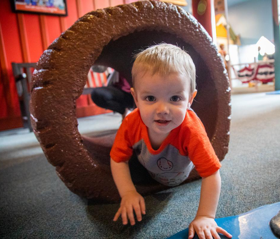 Kid through log